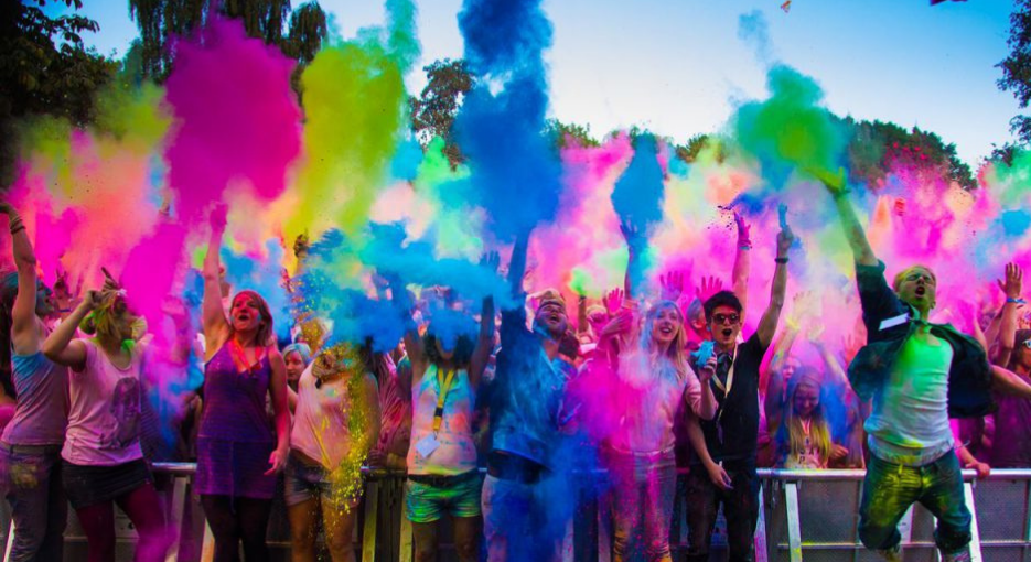 ShowMaker corporate Holi event - employees playing with organic colours