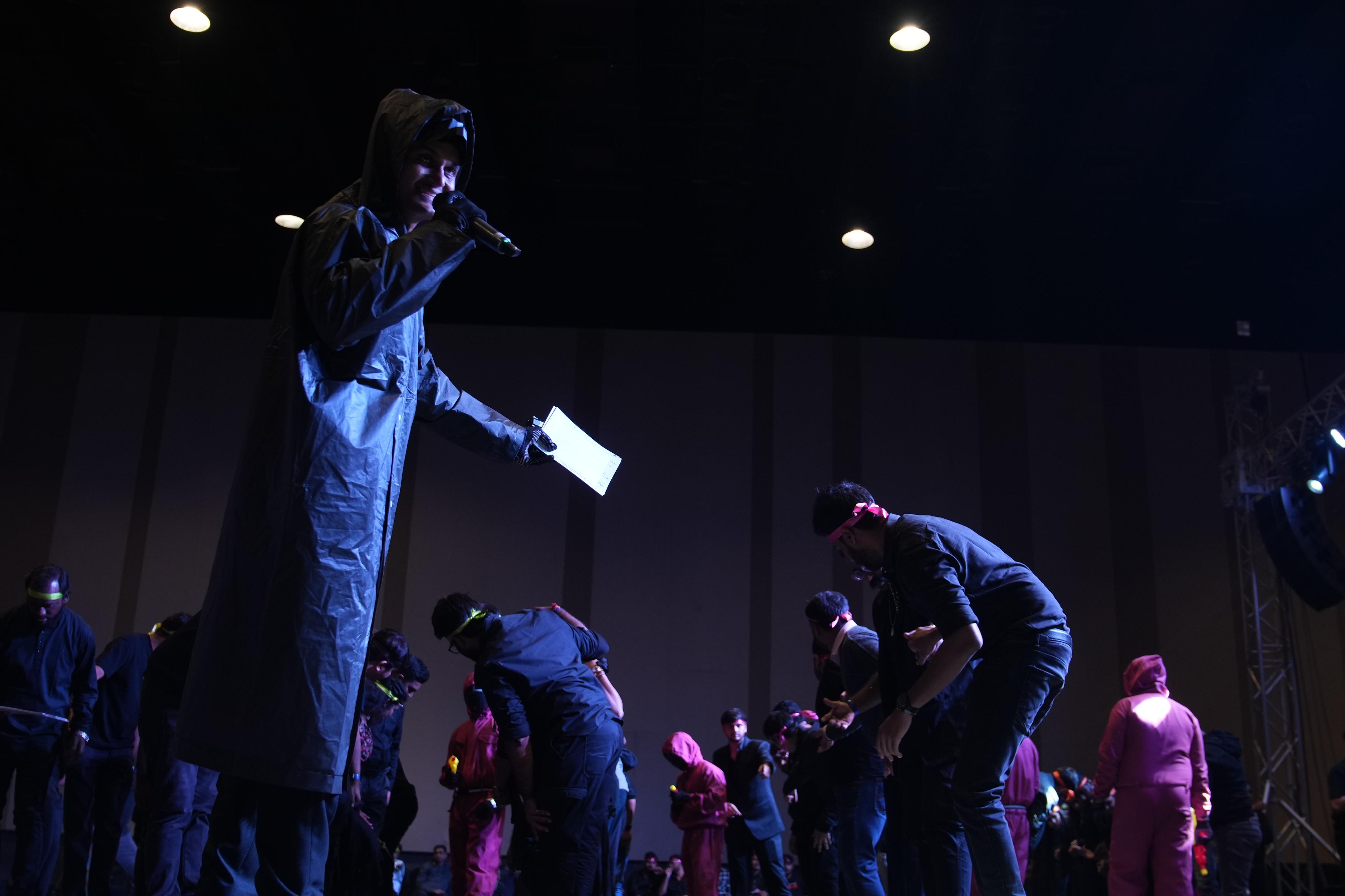 Immersive themed performance under spotlights